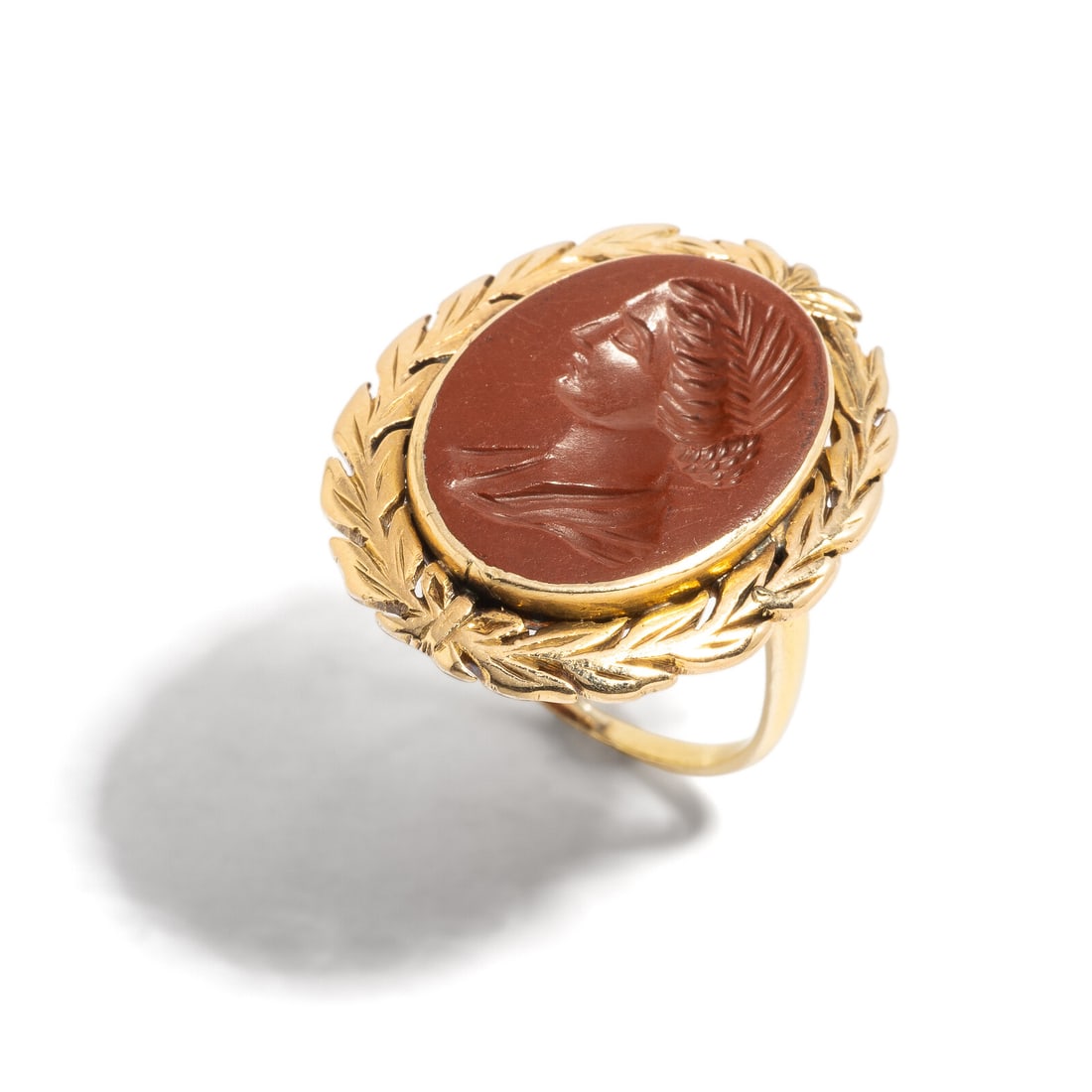 A Roman Red Jasper Intaglio with the Bust of a Matrona: A Roman Red Jasper Intaglio with the Bust of a Matrona Set in a 19th Century gold ring Circa 2nd-3rd Century A.D. Width 2 cm (3/4 inch); Ring size 6 1/2; High karat gold; 4.85 grams. Provenance: