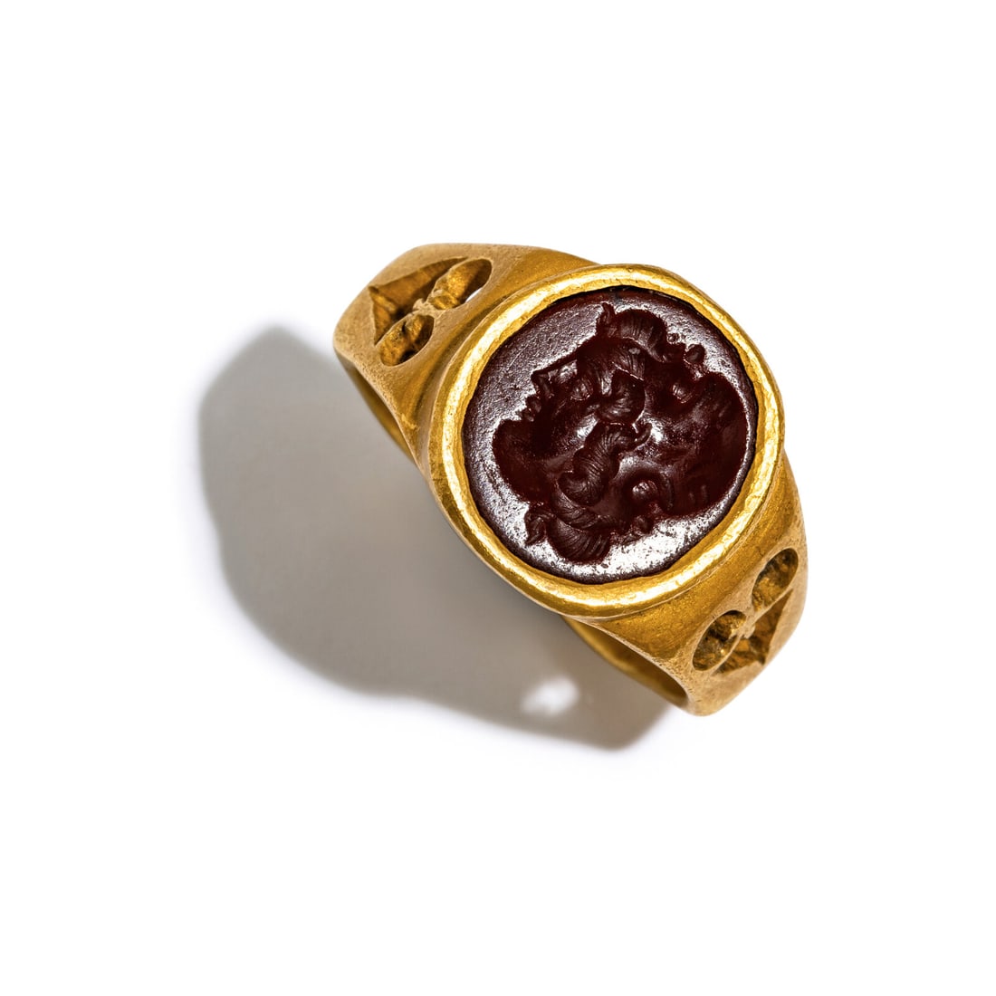 A Roman Gold and Red Jasper Ring with a Gryllos: A Roman Gold and Red Jasper Ring with a Gryllos Circa 3rd Century A.D. Width 2.5 cm (1 inch); Ring size 8 1/2; High karat gold; 12.67 grams. Property from a Florida Private Collection Provenance: Livi