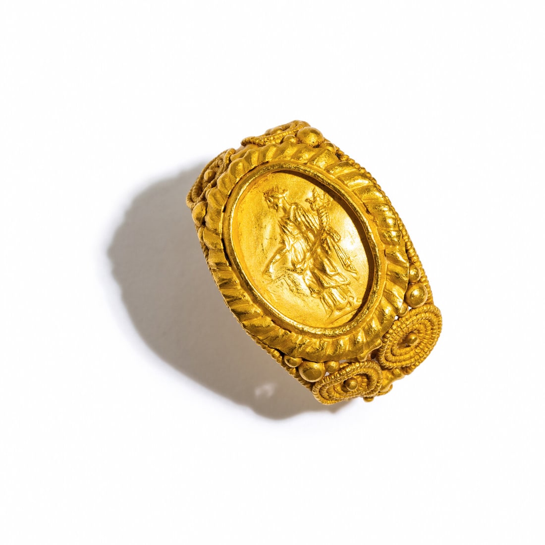 A Roman Gold Ring with Aequitas: A Roman Gold Ring with Aequitas Circa 4th Century A.D. Width 2.6 cm (1 inch); Ring size 8; High karat gold; 10 grams. Property from a Florida Private Collection Provenance: Alison Barker Estate,