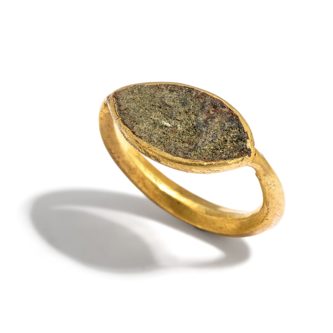 A Roman Gold and Glass Paste Finger Ring: A Roman Gold and Glass Paste Finger Ring Circa 1st-2nd Century A.D. Width 2.4 cm (1 inch); Ring size 6; High karat gold; 6.8 grams. Provenance: Private Collection, Bergen County, New Jersey, formed