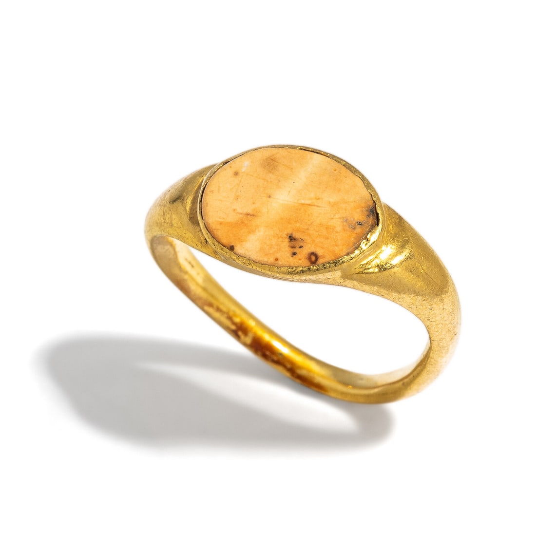A Roman Gold and Agate Finger Ring: A Roman Gold and Agate Finger Ring Circa 1st-2nd Century A.D. Width 1.9 cm (3/4 inch); Ring size 3 1/2; High karat gold; 3.4 grams. Provenance: Private Collection, Bergen County, New Jersey, formed