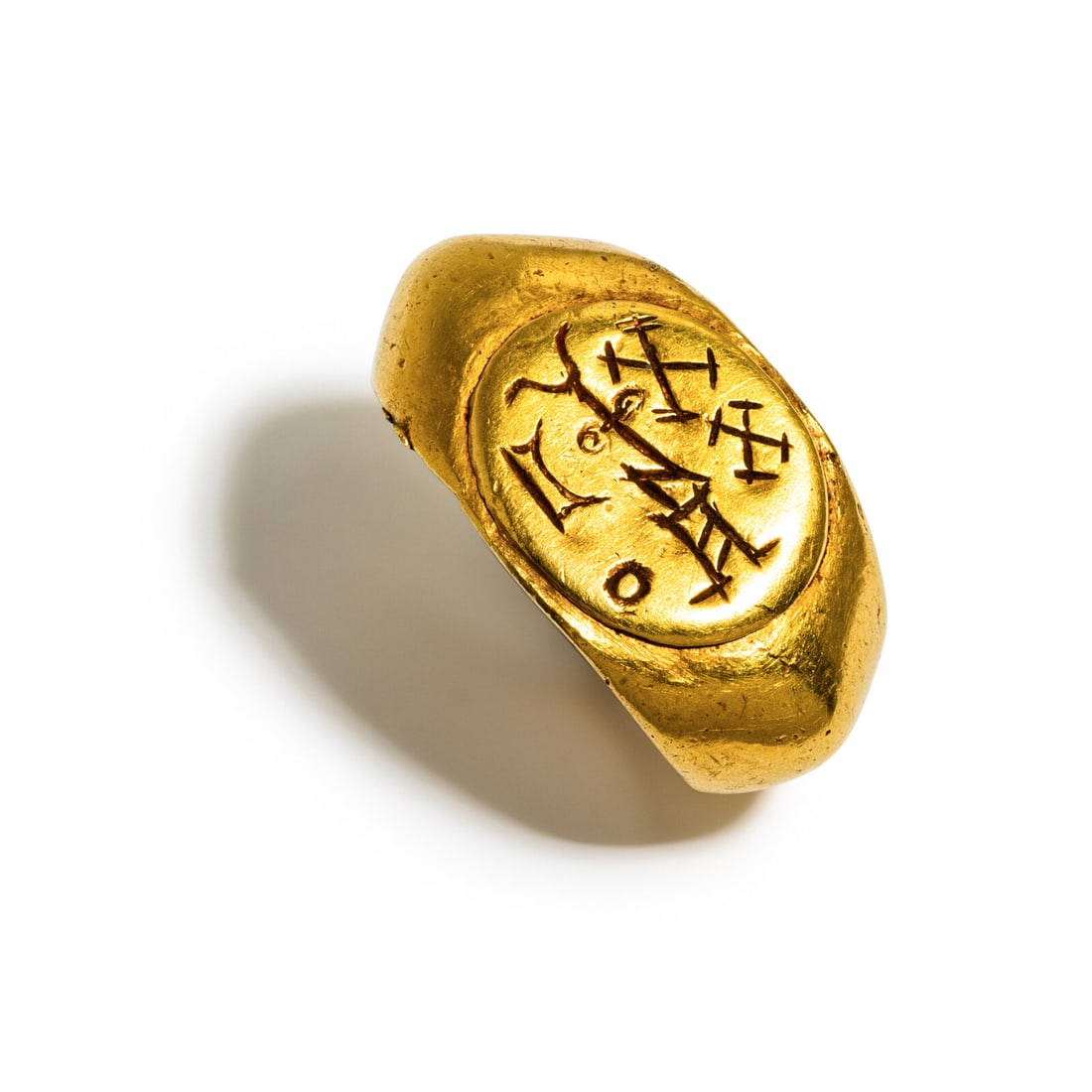 A South Arabian Gold Signet Ring: A South Arabian Gold Signet Ring Circa 4th-5th Century A.D. Width 2.3 cm (7/8 inch); Ring size 1 3/4; High karat gold; 10 grams. Property from a Florida Private Collection Provenance: Kamal Taffal, Jo