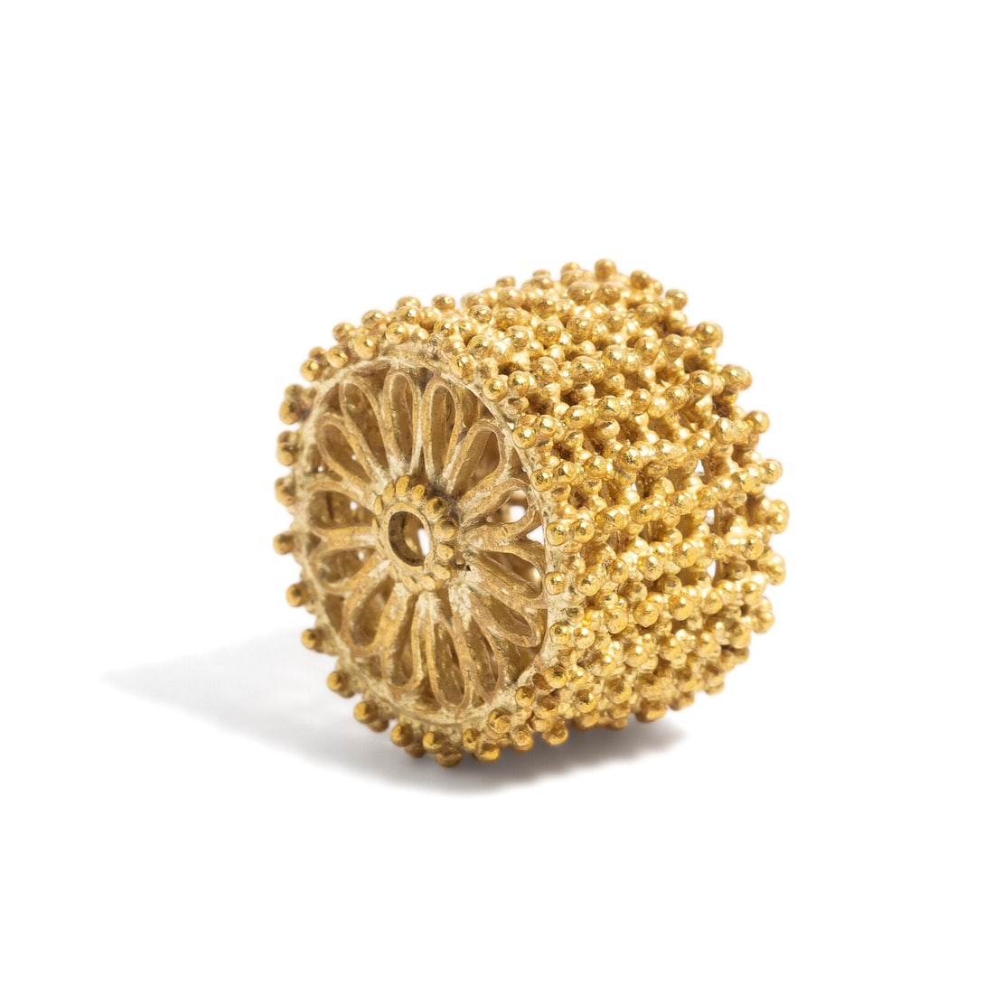 A Byzantine or Islamic Gold Spacer Bead: A Byzantine or Islamic Gold Spacer Bead Circa 7th-10th Century A.D. Diameter 1.5 cm (5/8); High karat gold; 3.94 grams. Provenance: Private Collection, New York, 2000s.