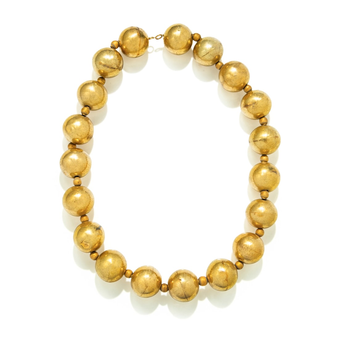 A Byzantine or Islamic Gold Necklace: A Byzantine or Islamic Gold Necklace Circa 7th-8th Century A.D. Length 54 cm (21 1/4 inches); High karat gold; 99 grams. Provenance: Mehdi Mahboubian (1921-2005), New York and London. Patti Cadb