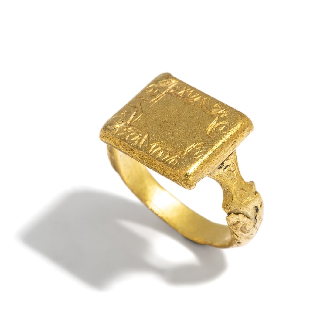 A Seljuk Gold Finger Ring: A Seljuk Gold Finger Ring Circa 11th-12th Century A.D. Width 1.8 cm (3/4 inch); Ring size 4 1/2; High karat gold; 6.9 grams. Provenance: Private Collection, Bergen County, New Jersey, formed in the 19