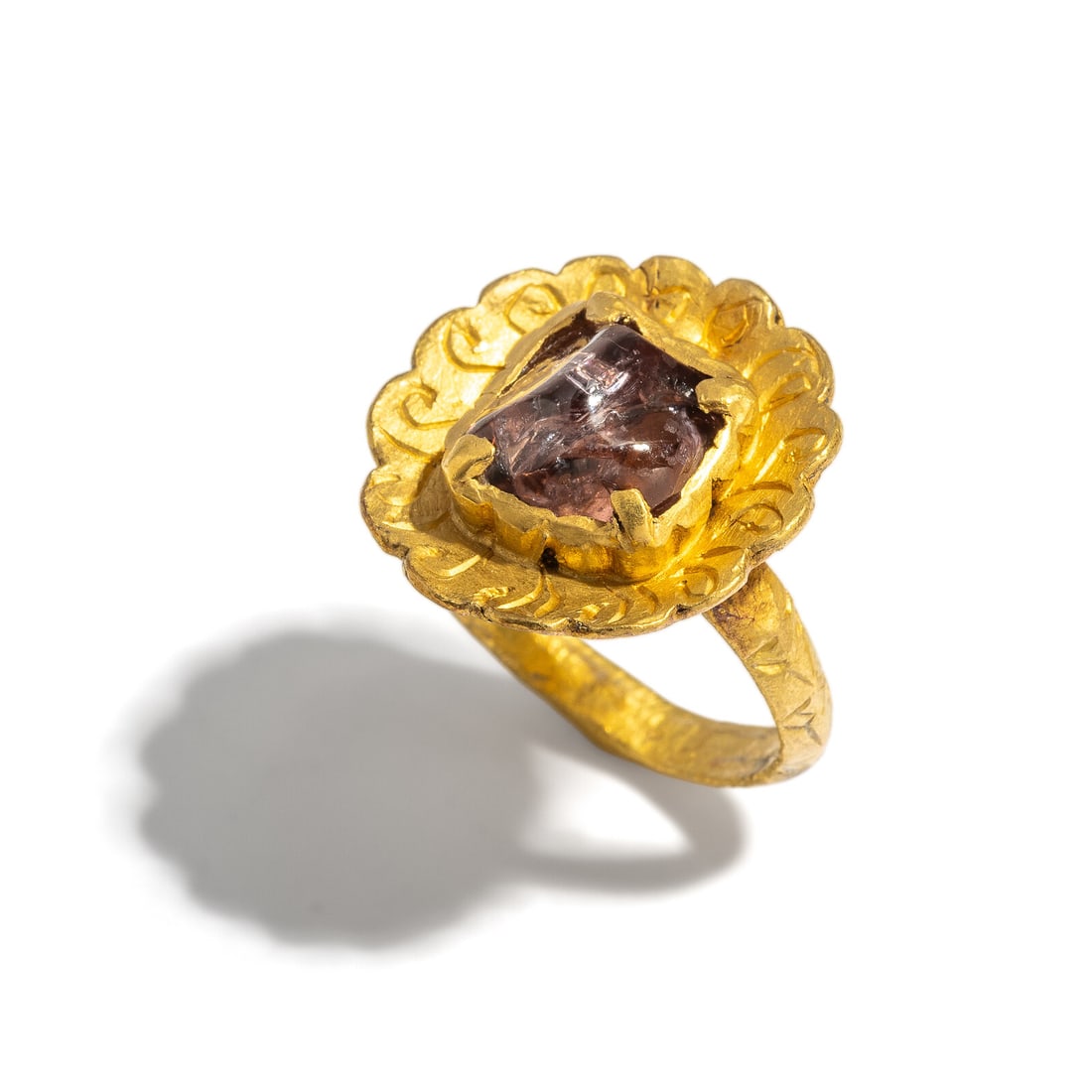 A Javanese Gold and Pink Tourmaline Finger Ring: A Javanese Gold and Pink Tourmaline Finger Ring Circa 12th Century A.D. Height 2.2 cm (7/8 inch); Ring size 5 1/4; High karat gold; 7.27 grams. Provenance: Private Collection, Bergen County, New