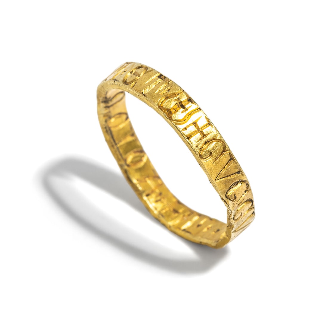 An English Gold Posy Ring: An English Gold Posy Ring Circa 13th-15th Century A.D. Width 2.2 cm (7/8 inch); Ring size 9 1/2; High karat gold; 3.77 grams. Provenance: Art Market, New York, 2000s.