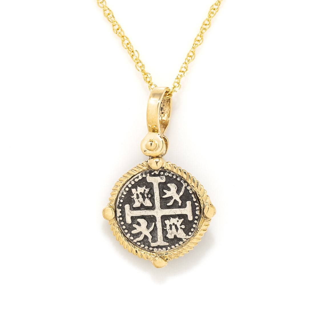 A Spanish Silver 2 Reales: A Spanish Silver 2 Reales Set in a gold pendant Circa 17th Century A.D. Length of chain 40.6 cm (16 inches); 14 karat gold; 5 grams. Provenance: Private Collection, New York, 2000s.