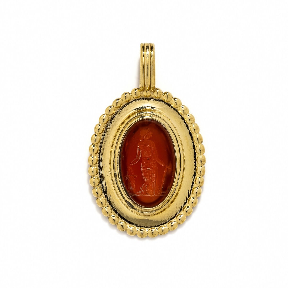 A Gold and Carnelian Pendant with a Female Figure: A Gold and Carnelian Pendant with a Female Figure Height 3.6 cm (1 3/8 inches); High karat gold; 8.32 grams.