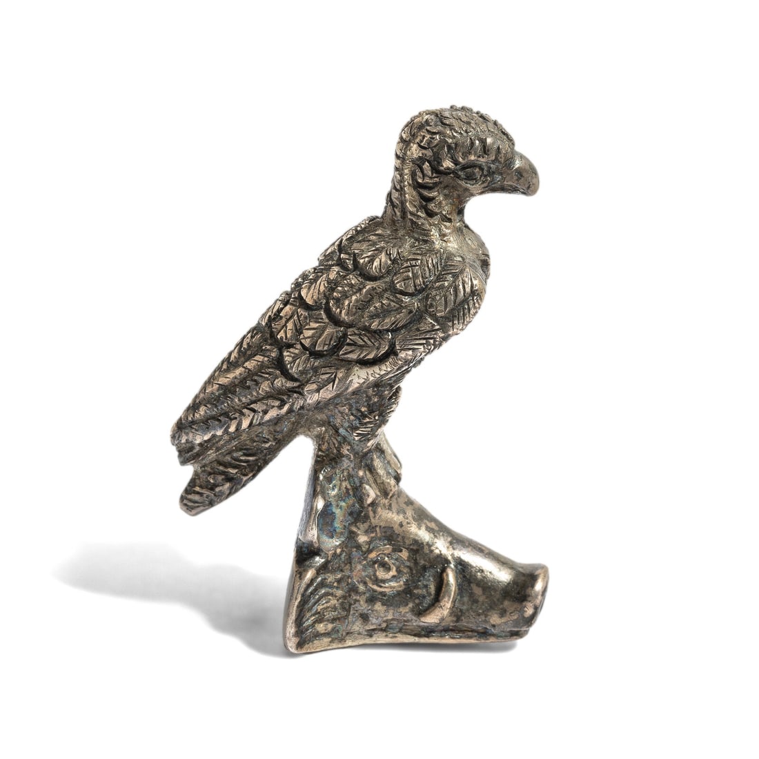 A Silver Eagle Perched on a Boar's Head: A Silver Eagle Perched on a Boar's Head Height 5.5 cm (2 1/8 inches); 97.71 grams. Property from the Estate of Andrew Cunningham Ware Provenance: Andrew Cunningham Ware Collection (1945–2024), S