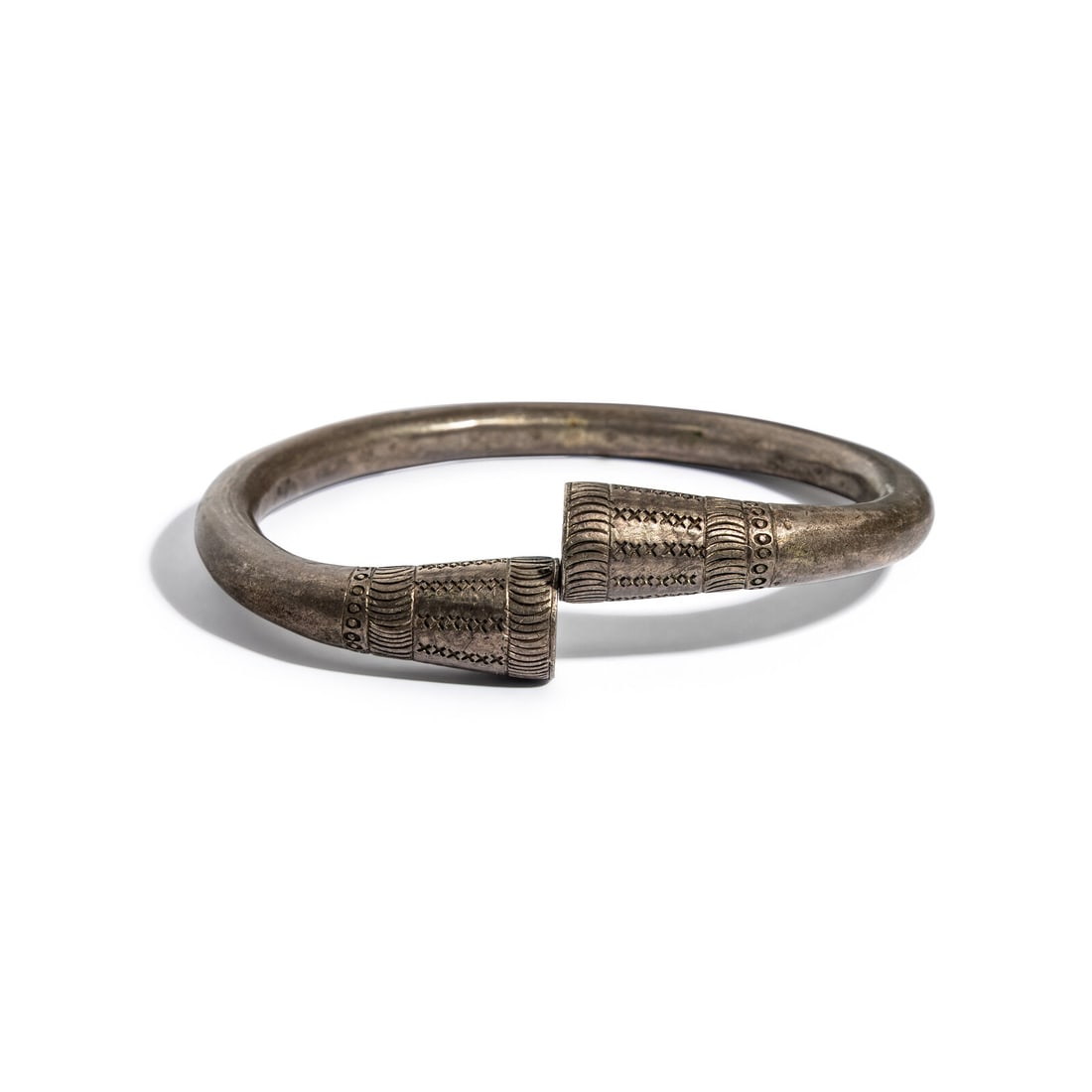 A Byzantine Silver Bracelet: A Byzantine Silver Bracelet Circa Late 5th-6th Century A.D. Width 9.5 cm (3 3/4 inches); 177.8 grams. Provenance: Fortuna Fine Arts, New York, 1998 (The Gift of the Gods, p. 105, no. 181). [part]