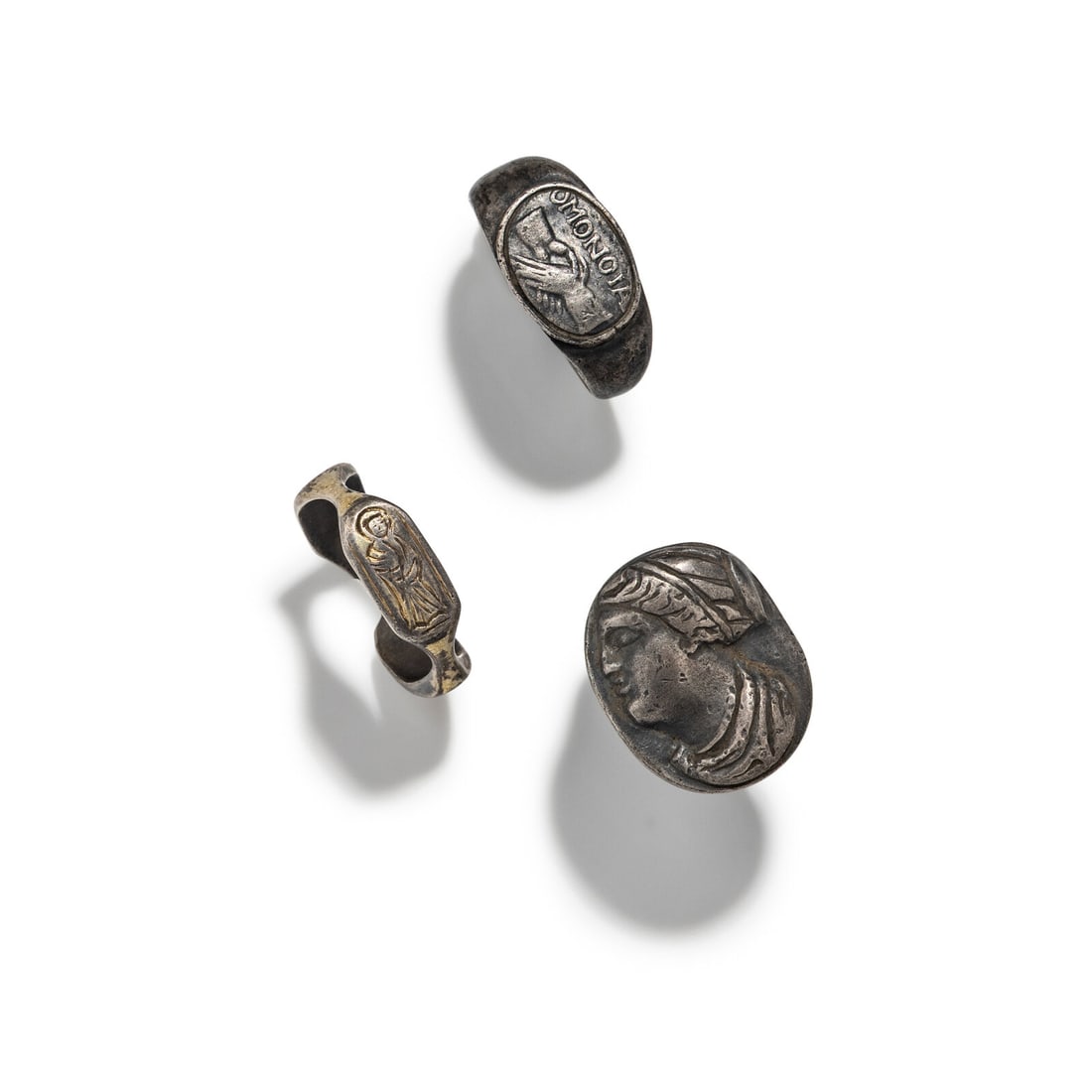 Three Roman Silver Finger Rings: Three Roman Silver Finger Rings Circa 1st-7th Century A.D. Ring size of largest 9; Width 2.4 cm (1 inch); 23.63 grams. Property from the Collection of Mr. Felix Brejente, Schaumburg, Illinois 