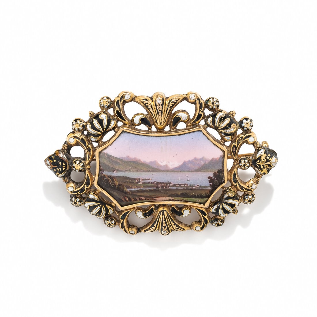 ANTIQUE, PAINTED PORCELAIN, ENAMEL, AND YELLOW GOLD BROOCH: ANTIQUE, PAINTED PORCELAIN, ENAMEL, AND YELLOW GOLD BROOCH Painted porcelain measuring approximately 29.00 x 17.25 mm depicting a landscape, and black and white enamel. Yellow gold. 2 1/8 x 1 3/8