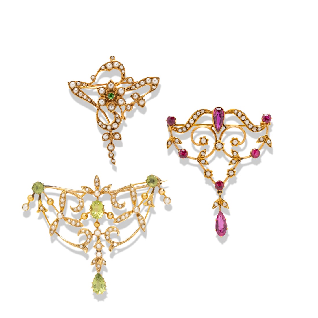 COLLECTION OF SEED PEARL AND MULTIGEM PENDANT BROOCHES: COLLECTION OF SEED PEARL AND MULTIGEM PENDANT BROOCHES Including three brooches, one set with seed pearls and oval and round peridots, one set with seed pearls and a round peridot, and one set with
