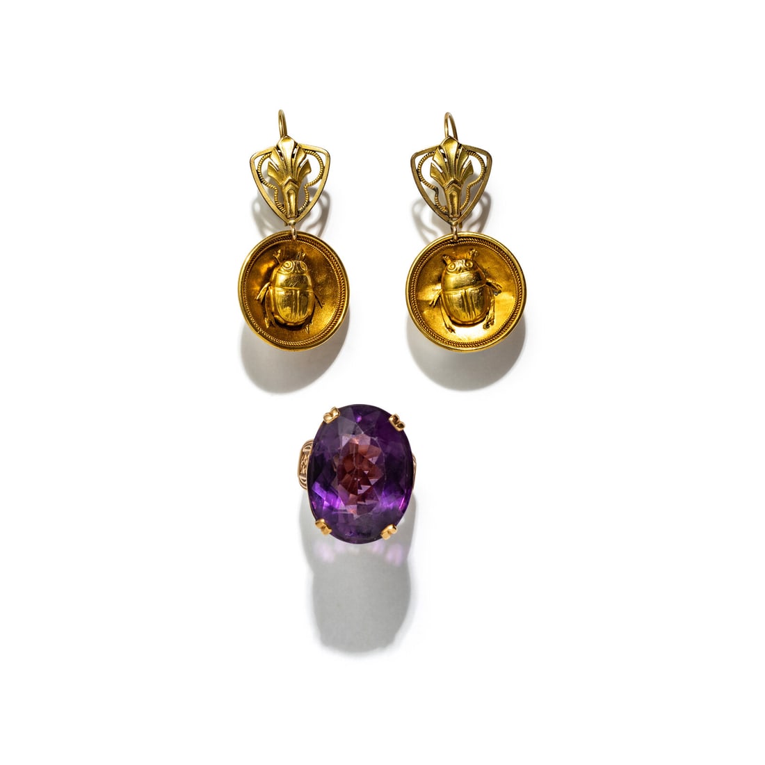 GOLD SCARAB EARRINGS AND AMETHYST RING: GOLD SCARAB EARRINGS AND AMETHYST RING Including a pair of scarab earrings and a ring with an amethyst weighing approximately 21.00 carats by formula. Yellow gold and 14 karat rose gold. Earrings: 1