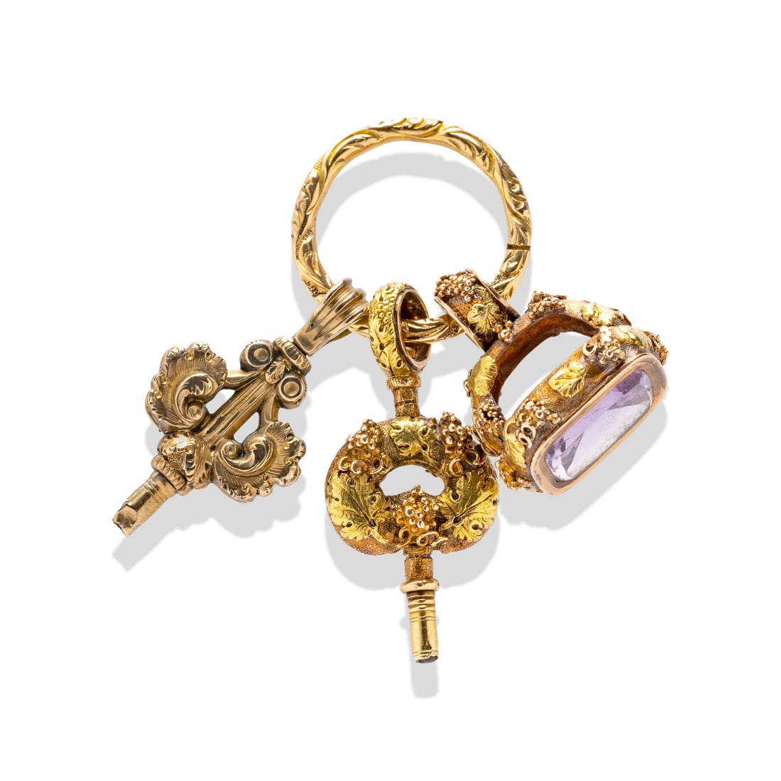 COLLECTION OF WATCH KEYS AND FOBS: COLLECTION OF WATCH KEYS AND FOBS Cushion cut amethyst measuring approximately 12.42 x 10.95 mm. Yellow gold and gold filled. 2 inches long. Gross weight: 13.55 dwt. Property from the Estate of Mrs. J