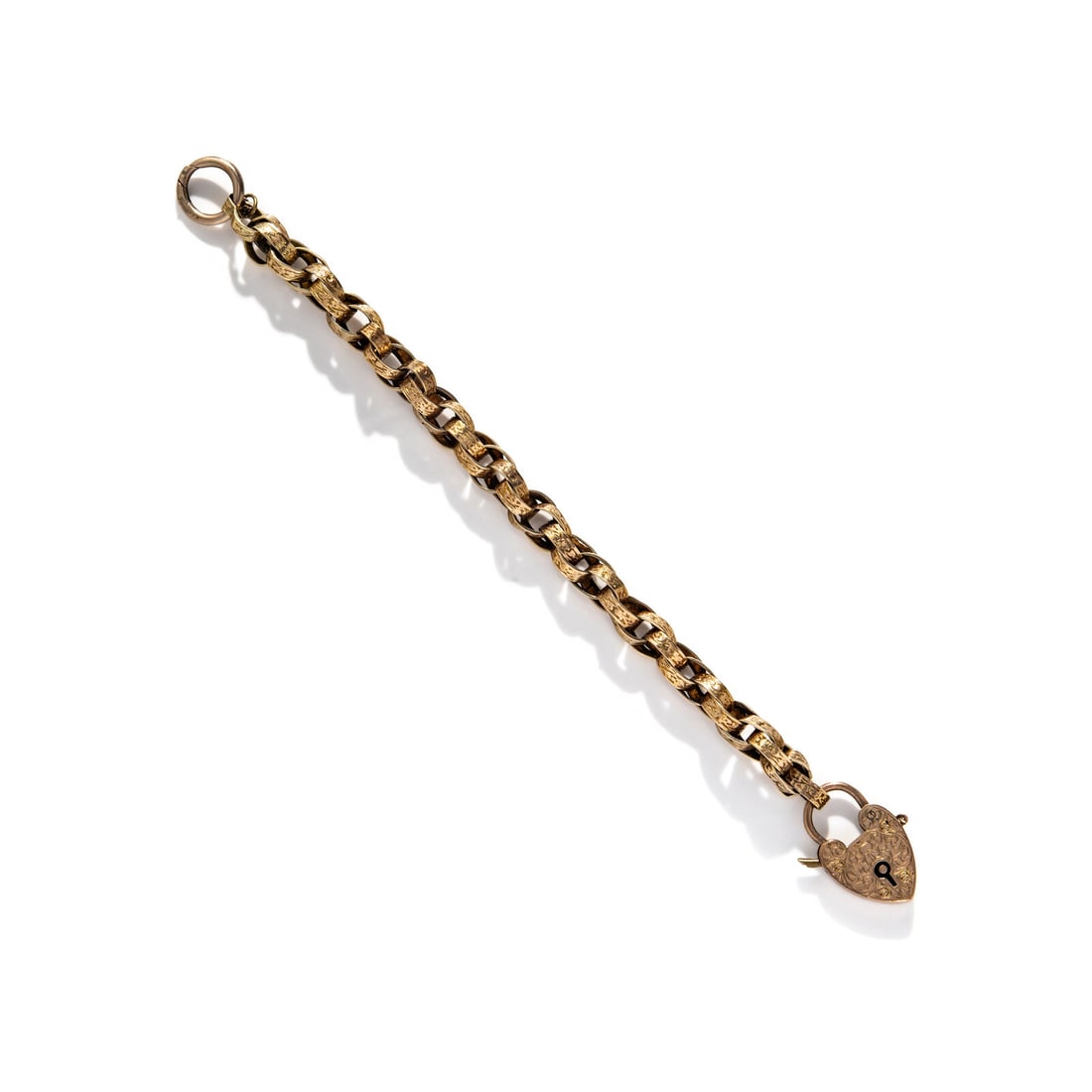 VICTORIAN, CHAIN BRACELET WITH HEART LOCK CHARM: VICTORIAN, CHAIN BRACELET WITH HEART LOCK CHARM Yellow gold and low-karat rose gold. 7 1/4 inches long. Charm stamp: DB 9 .375 (British hallmarks). Gross weight: 9.40 dwt. Sold with extra bracelet lin