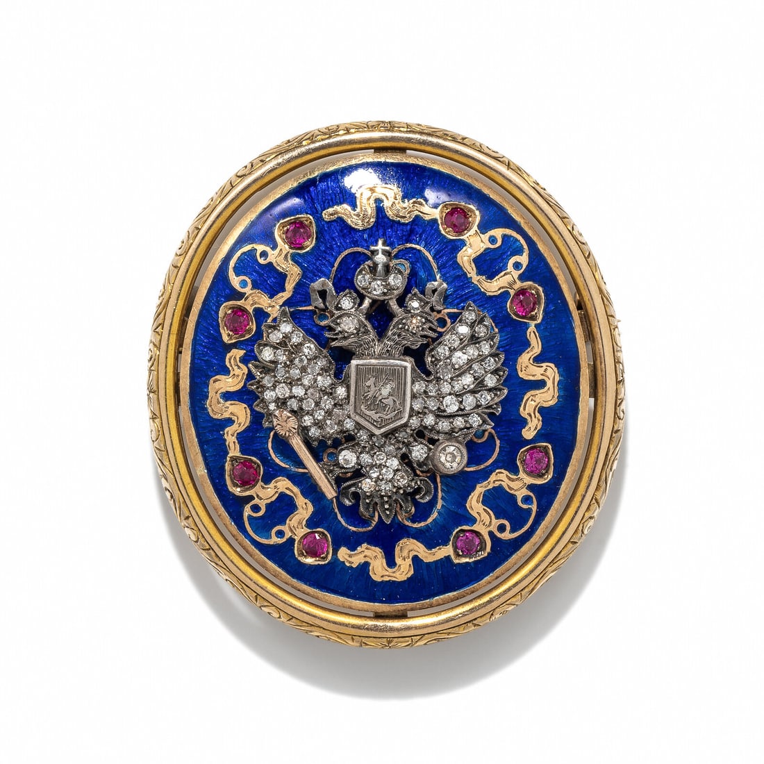 RUSSIAN, ENAMEL, SYNTHETIC RUBY, AND DIAMOND BROOCH: RUSSIAN, ENAMEL, SYNTHETIC RUBY, AND DIAMOND BROOCH Blue enamel, round synthetic rubies, and transitional and single cut diamonds. Silver and yellow gold. 2 x 1 1/2 inches. Gross weight: 13.85 dwt. Pr