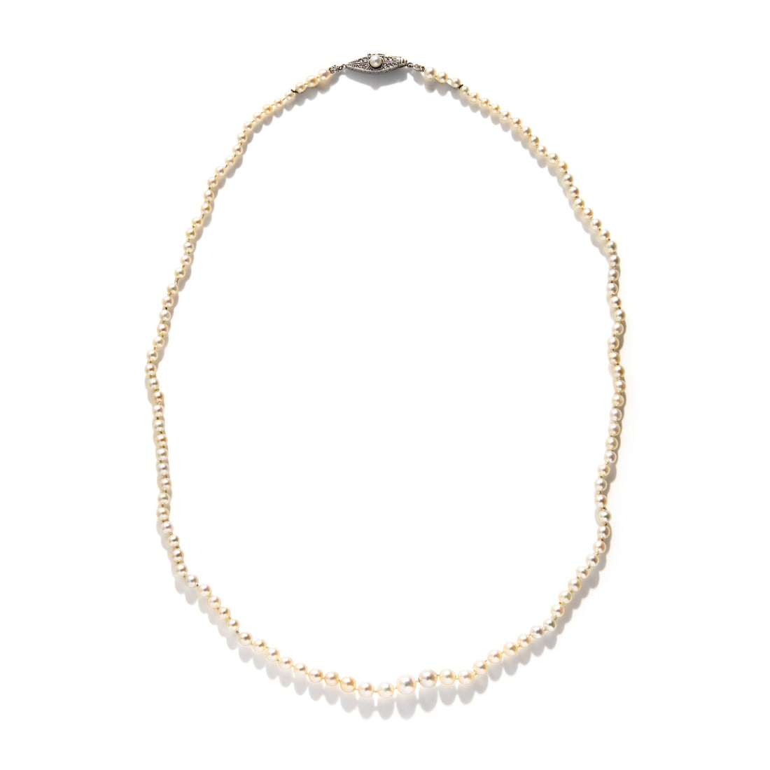 CULTURED PEARL STRAND WITH PLATINUM AND DIAMOND CLASP: CULTURED PEARL STRAND WITH PLATINUM AND DIAMOND CLASP Graduated cultured pearls measuring approximately 2.70 - 5.75 mm, the clasp set with rose cut diamonds. Mounted in platinum. 20 1/2 inches long.