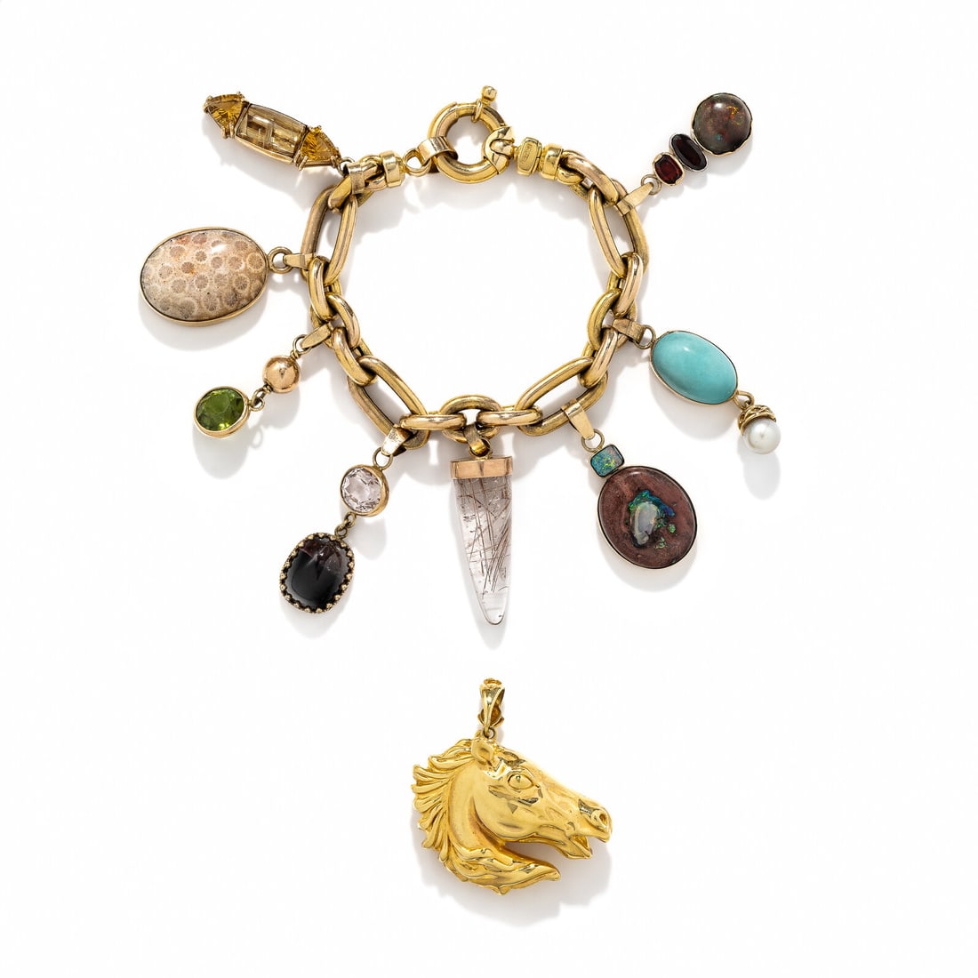YELLOW GOLD AND MULTIGEM CHARM BRACELET: YELLOW GOLD AND MULTIGEM CHARM BRACELET Including nine charms set with various gemstones, including kunzite, rutilated quartz, cultured pearls, opal, and peridot. Yellow gold. Bracelet: 7 inches