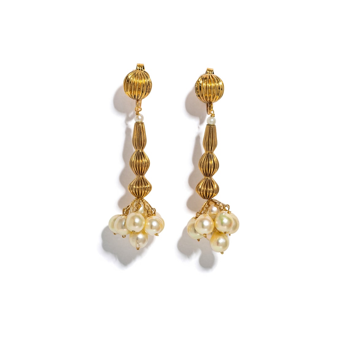 YELLOW GOLD AND CULTURED PEARL PENDANT EARRINGS: YELLOW GOLD AND CULTURED PEARL PENDANT EARRINGS Cultured pearls measuring approximately 5.90 - 6.25 mm and seed pearls. 14 karat yellow gold. 2 1/8 inches long. Stamp: 14K. Gross weight: 8.60 dwt.