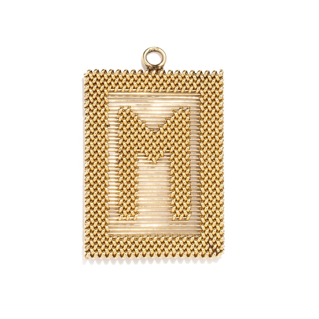 YELLOW GOLD 'M' PENDANT: YELLOW GOLD 'M' PENDANT Yellow gold. 2 1/2 x 1 5/8 inches. Stamp: (partially obscured maker's mark). Gross weight: 18.85. Property of an Atlanta Collector This lot is located in Chicago.