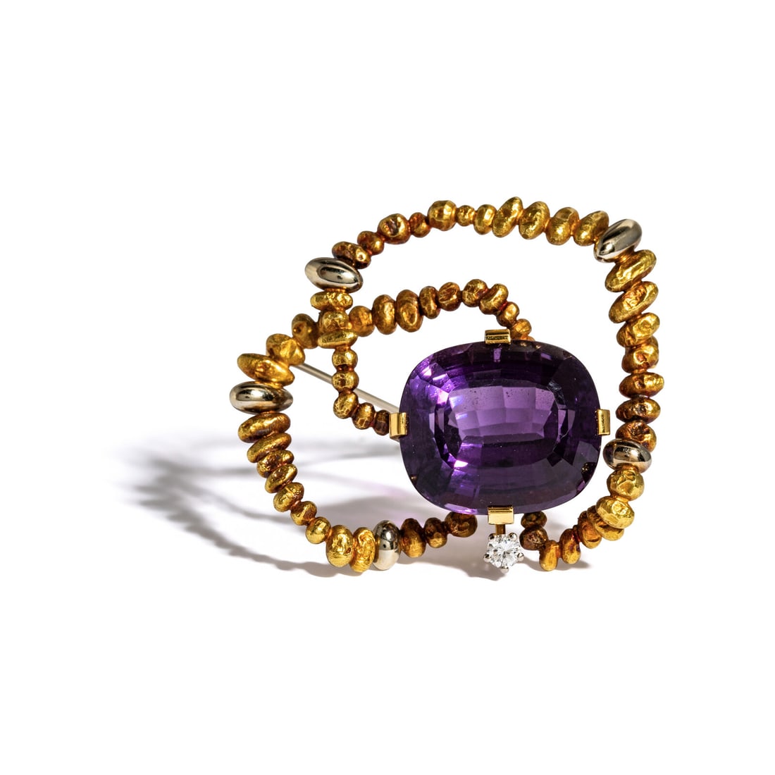 YELLOW GOLD, AMETHYST, AND DIAMOND BROOCH: YELLOW GOLD, AMETHYST, AND DIAMOND BROOCH Cushion cut amethyst measuring approximately 18.50 x 16.45 x 11.80 mm and one round diamond weighing approximately 0.12 carats. 18 karat yellow gold. 1 1/2 in