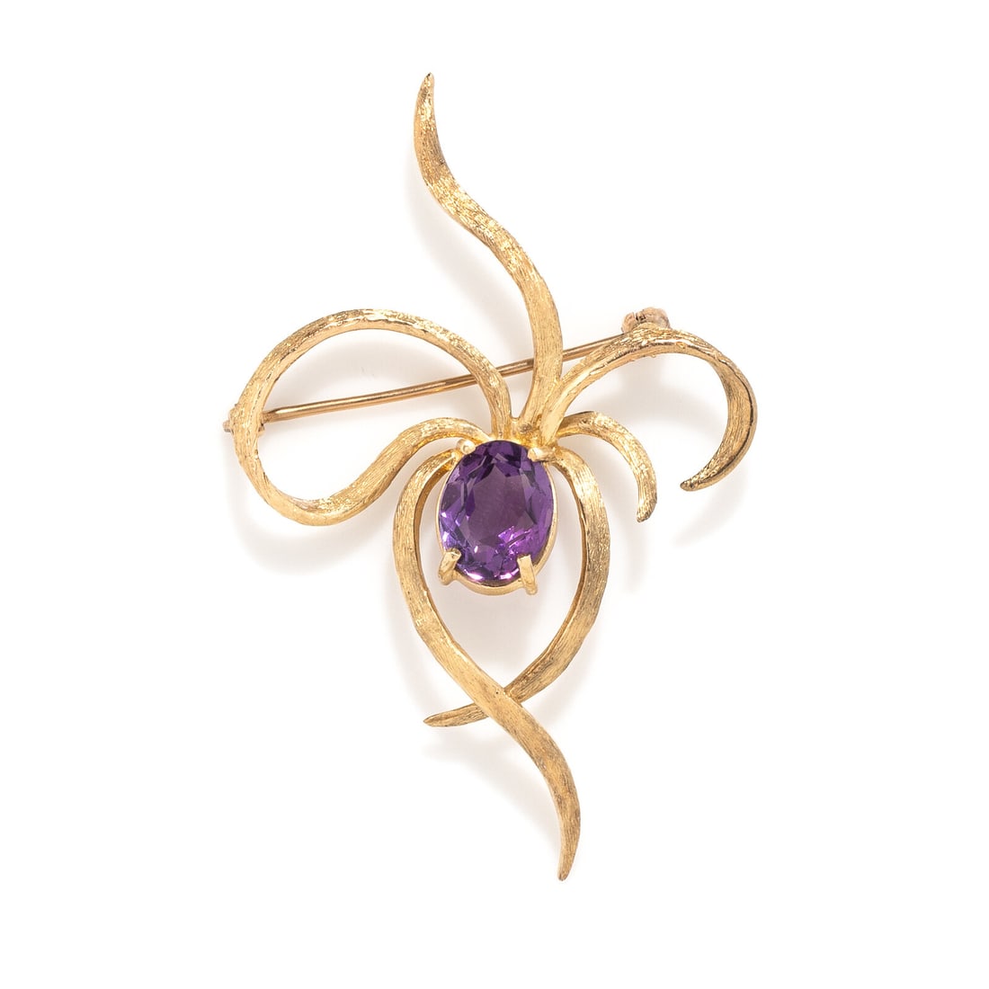 AMETHYST AND YELLOW GOLD BROOCH: AMETHYST AND YELLOW GOLD BROOCH Oval amethyst weighing approximately 2.00 carats by formula. 14 karat yellow gold. 2 1/4 x 1 1/2 inches. Stamp: (partially obscured) ELT 14K. Gross weight: 3.80 dwt.