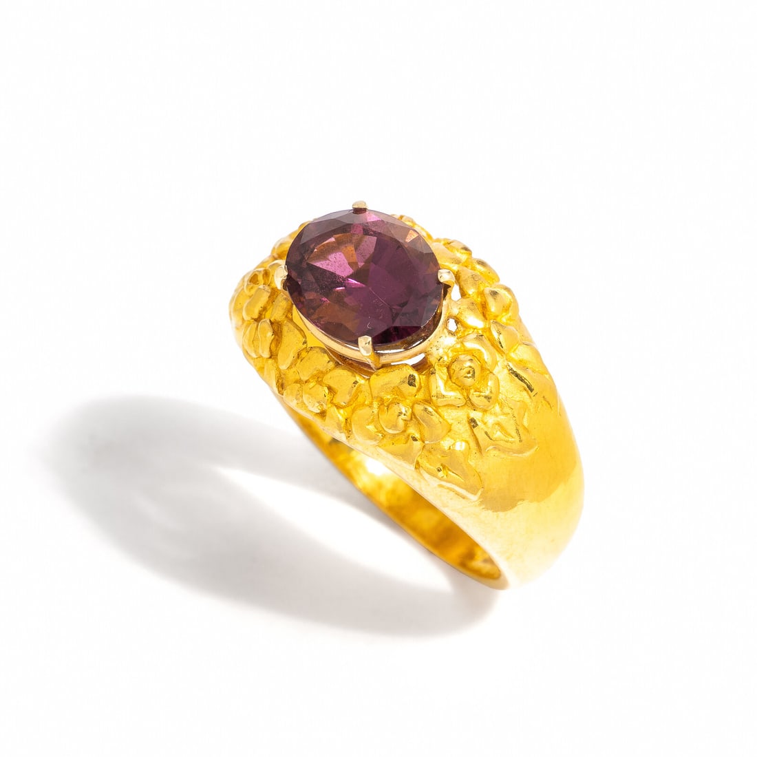 HIGH-KARAT YELLOW GOLD AND PINK TOURMALINE RING: HIGH-KARAT YELLOW GOLD AND PINK TOURMALINE RING Oval pink tourmaline weighing approximately 2.50 carats by formula. High-karat yellow gold. Ring size 7 3/4. Stamp: 999 (maker's mark). Ring: 8.00 dwt.