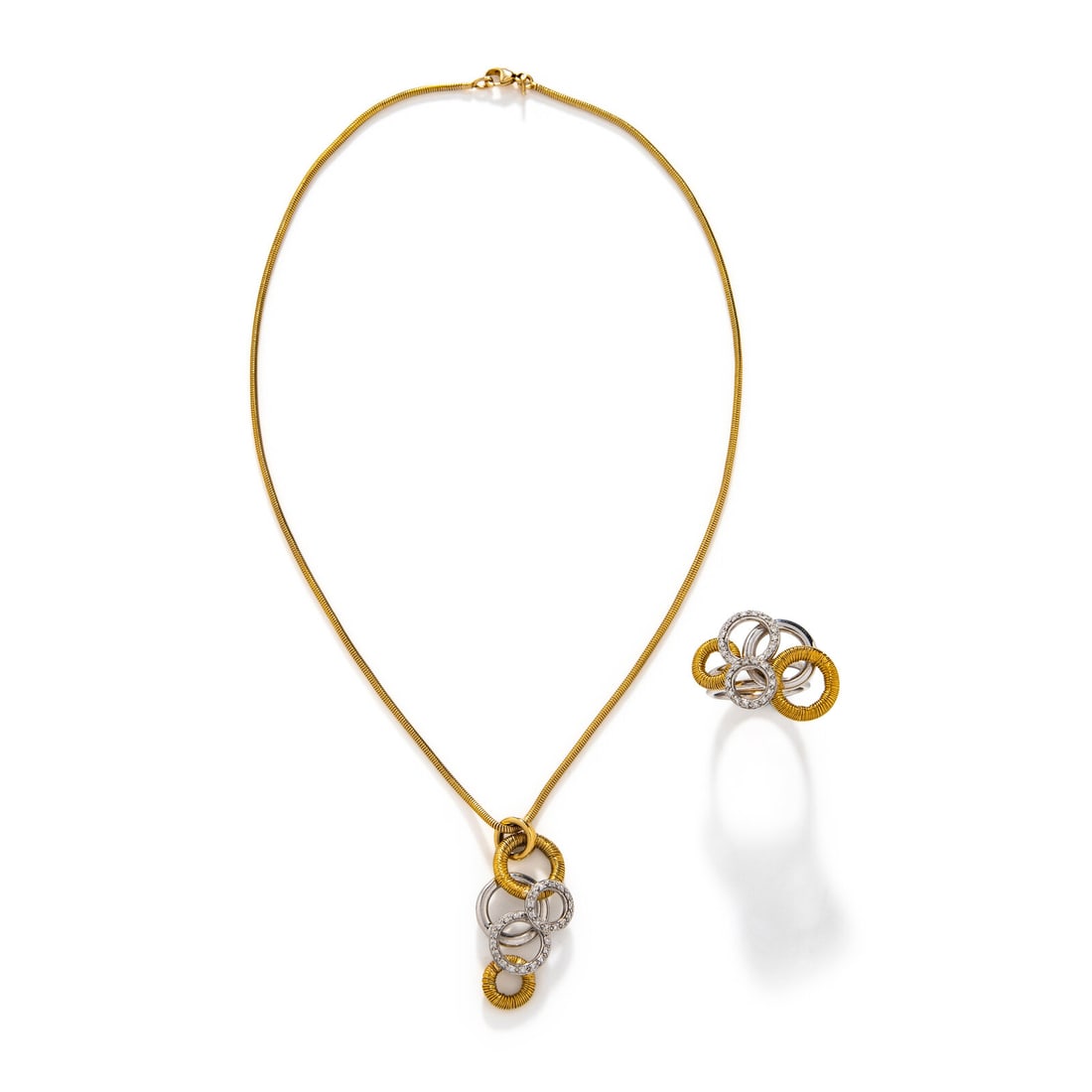 BICOLOR GOLD AND DIAMOND RING AND NECKLACE: BICOLOR GOLD AND DIAMOND RING AND NECKLACE Round diamonds. 18 karat white and yellow gold. Chain: 15 3/4 inches long. Pendant: 1 1/2 inches long. Ring size 6 3/4. Ring stamp: 750 2921 (partially