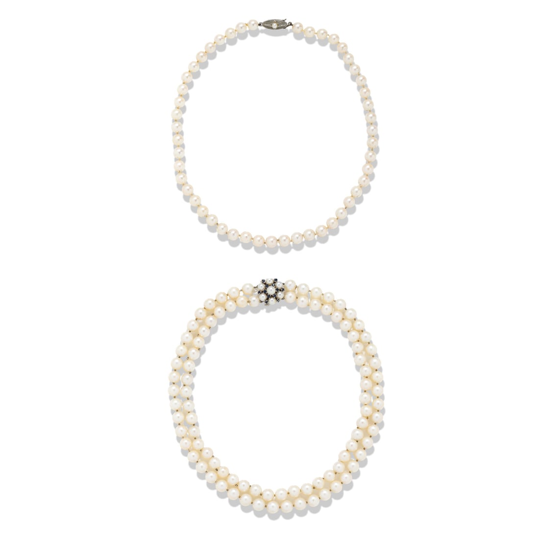 TWO CULTURED PEARL NECKLACES: TWO CULTURED PEARL NECKLACES Including two necklaces, one with two strands of cultured pearls measuring approximately 7.25 - 7.75 mm and a clasp set with round sapphires and cultured pearls, and the