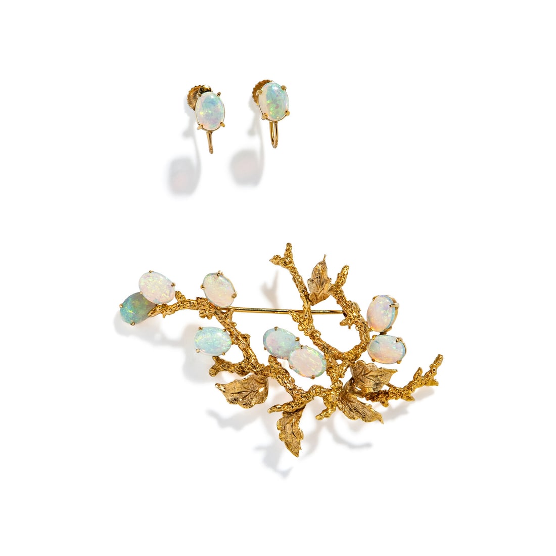 YELLOW GOLD AND OPAL EARRINGS AND BROOCH: YELLOW GOLD AND OPAL EARRINGS AND BROOCH Including one brooch and a pair of earrings with oval cabochon opals measuring approximately 8.15 x 6.15 x 2.05 mm each. 14 and 18 karat yellow gold. Brooch 2
