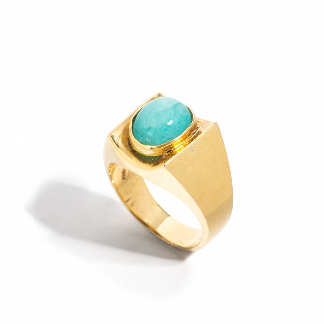 YELLOW GOLD AND TOURMALINE RING: YELLOW GOLD AND TOURMALINE RING Oval cabochon tourmaline weighing approximately 3.95 carats by formula. 14 karat yellow gold. Ring size 7 3/4. Stamp: 14k. Gross weight: 7.35 dwt. Property of a Lady,