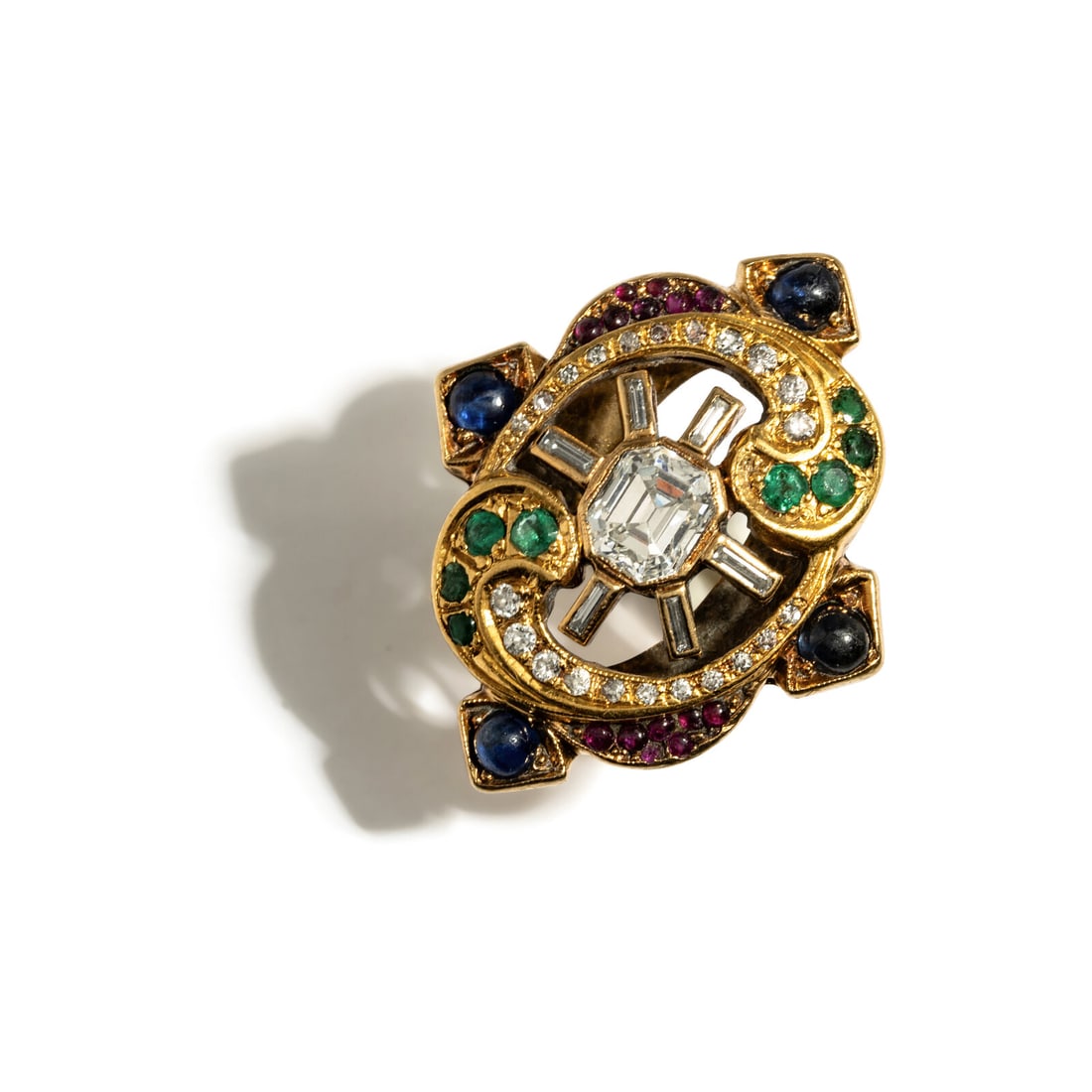 YELLOW GOLD, MULTIGEM, AND EMERALD CUT CUBIC ZIRCONIA RING: YELLOW GOLD, MULTIGEM, AND EMERALD CUT CUBIC ZIRCONIA RING Emerald cut cubic zirconia measuring approximately 7.20 x 6.25 x 4.65 mm, round cabochon sapphires and rubies, round emeralds, and round,