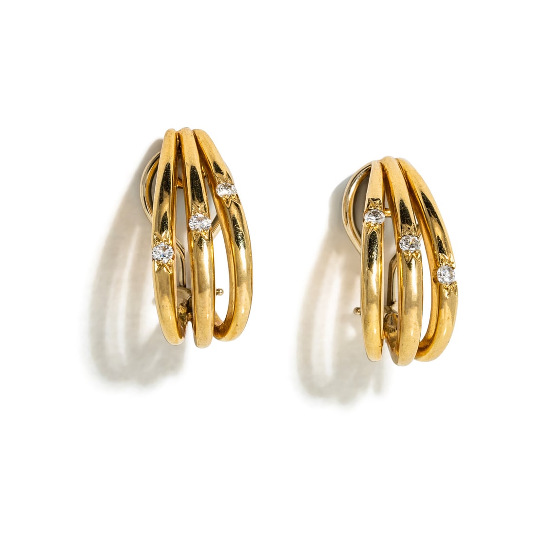 YELLOW GOLD AND DIAMOND HALF HOOP EARRINGS: YELLOW GOLD AND DIAMOND HALF HOOP EARRINGS Round diamonds. 14 karat gold. 3/4 inch long. Stamp: 14K. Gross weight: 6.95 dwt. Property of a Lady, Denver, Colorado This lot is located in Chicago.