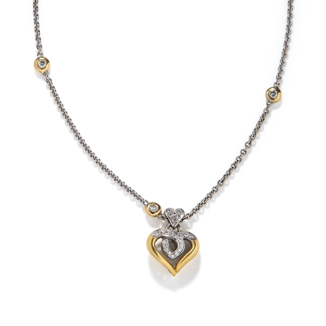 BICOLOR GOLD AND DIAMOND HEART NECKLACE: BICOLOR GOLD AND DIAMOND HEART NECKLACE Round diamonds weighing approximately 0.50 carat total. 18 karat and 14 karat yellow and white gold. 16 inches long. Pendant stamp: 750 (Italian maker's mark).