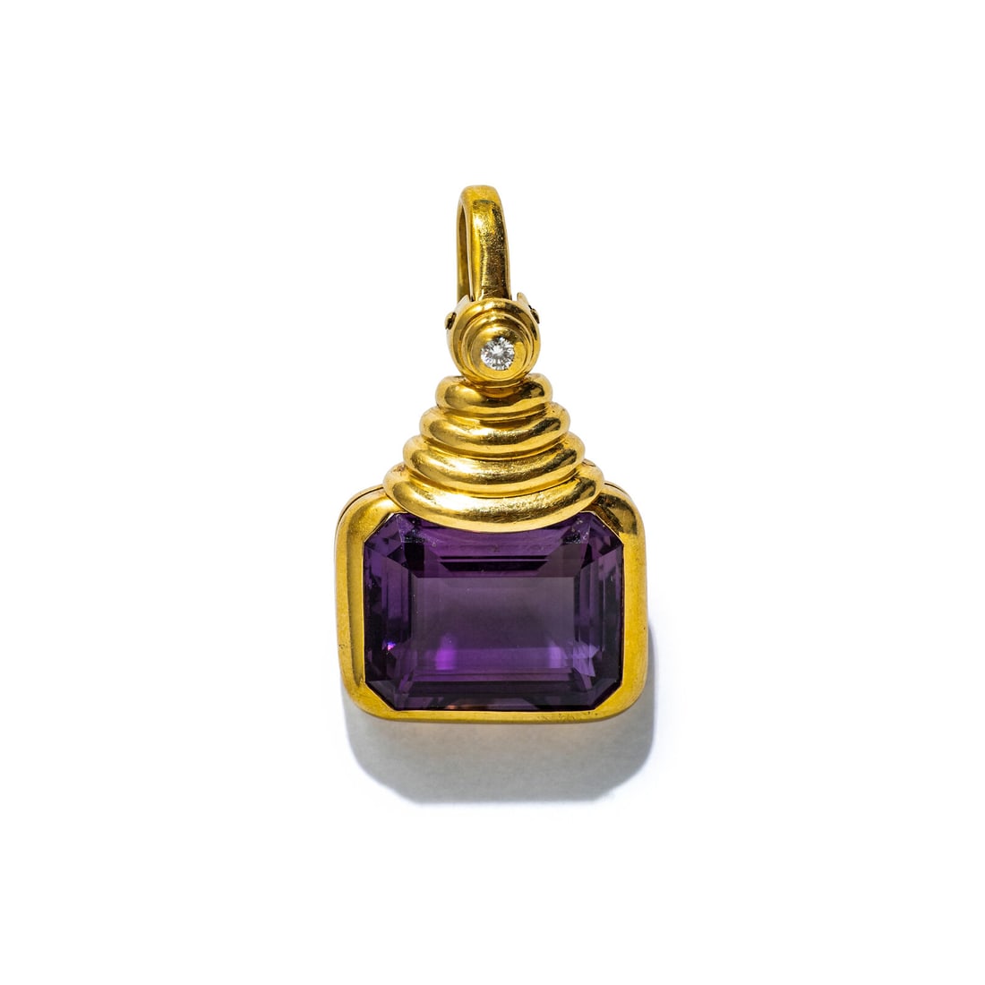 AMETHYST, DIAMOND, AND YELLOW GOLD ENHANCER PENDANT: AMETHYST, DIAMOND, AND YELLOW GOLD ENHANCER PENDANT Emerald cut amethyst weighing approximately 20.00 carats by formula and round diamond. 18 karat yellow gold. 1 1/2 x 7/8 inches. Stamp: RJ 455 18K.