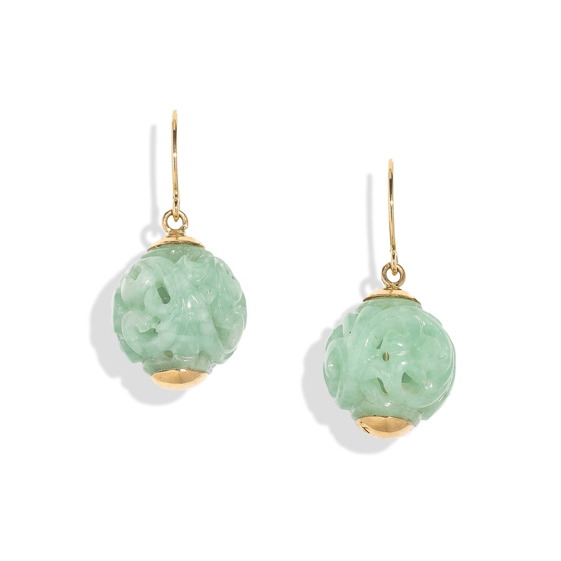 GUMPS, CARVED JADE AND YELLOW GOLD EARRINGS: GUMPS, CARVED JADE AND YELLOW GOLD EARRINGS Carved green jade beads. 14 karat yellow gold. 1 inch long. Stamp: GUMPS 14K. Gross weight: 5.45 dwt. From a West Coast Collection This lot is located in