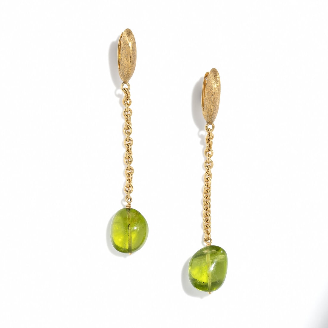 MARCO BICEGO, PERIDOT AND YELLOW GOLD PENDANT EARRINGS: MARCO BICEGO, PERIDOT AND YELLOW GOLD PENDANT EARRINGS Tumbled oval peridots measuring approximately 10.60 x 9.10 mm. 18 karat yellow gold. 2 inches long. Stamp: MARCO BICEGO (Italian maker's mark)
