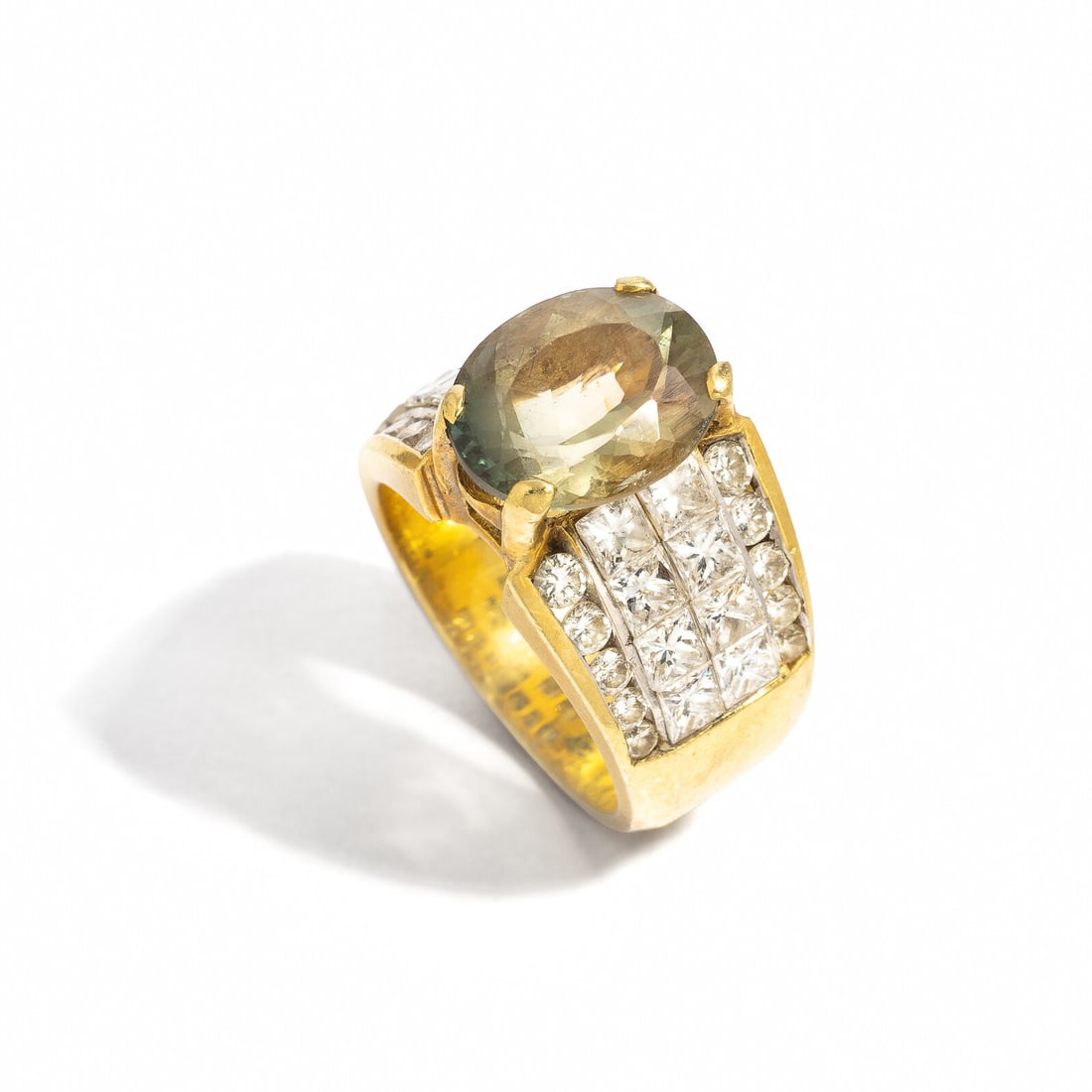 LABRADORITE FELDSPAR AND DIAMOND RING: LABRADORITE FELDSPAR AND DIAMOND RING Oval labradorite feldspar measuring approximately 11.05 x 9.05 x 6.25 mm, and princess cut and round diamonds weighing approximately 2.45 carats total. 18 karat y