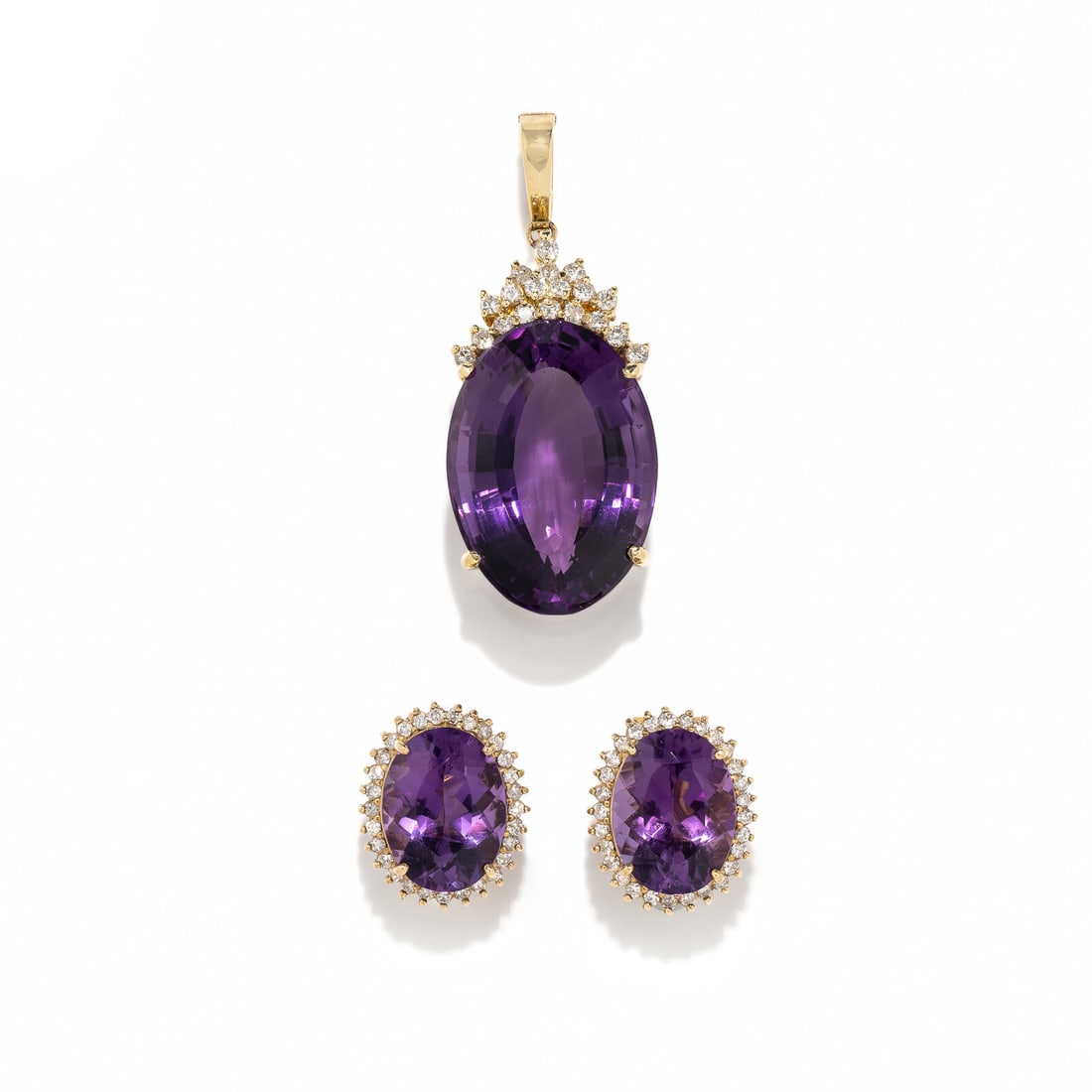 AMETHYST AND DIAMOND EARRINGS AND BROOCH: AMETHYST AND DIAMOND EARRINGS AND BROOCH Including a pendant with an oval amethyst weighing approximately 44.50 carats by formula and round diamonds, and earrings with oval amethysts weighing