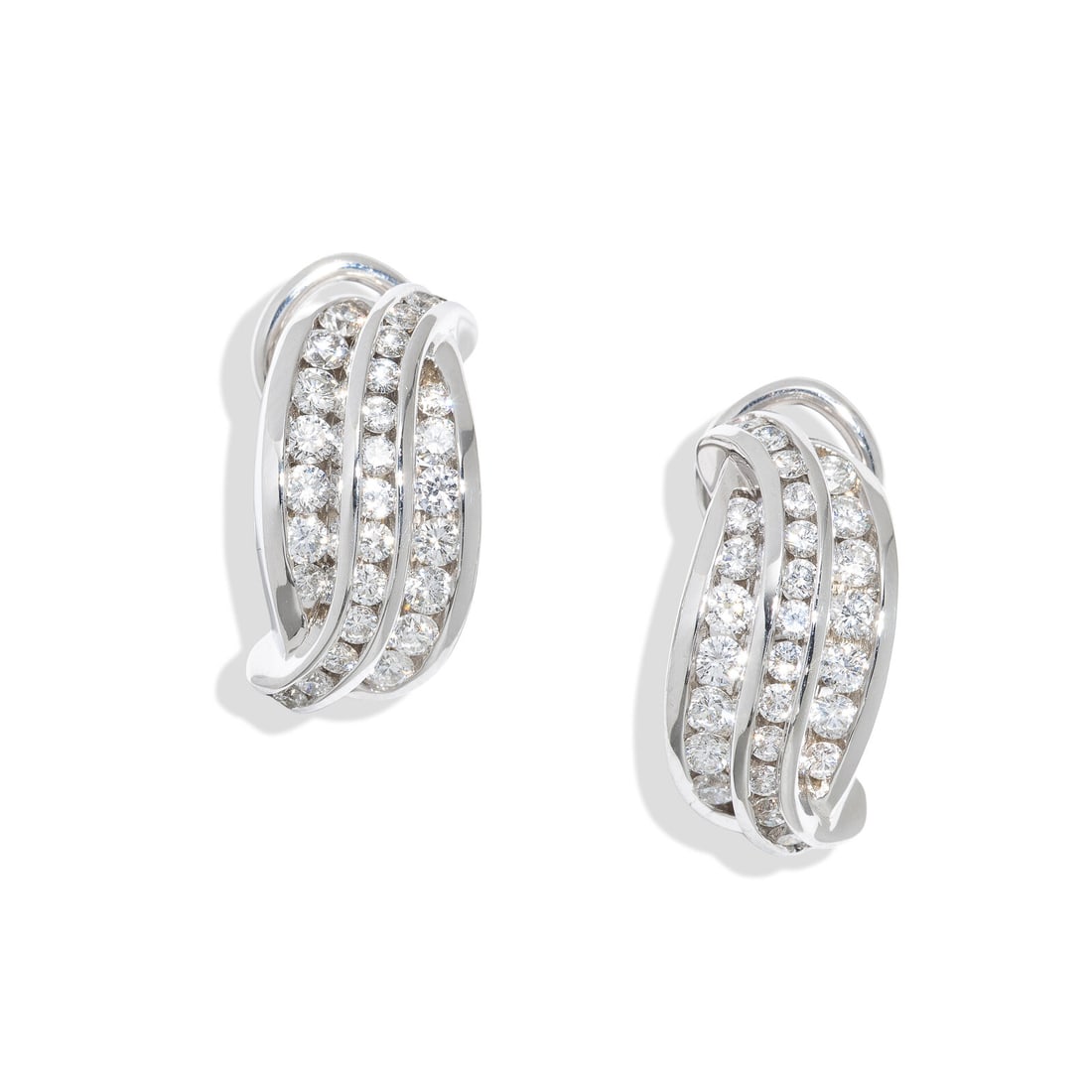 WHITE GOLD AND DIAMOND EARRINGS: WHITE GOLD AND DIAMOND EARRINGS Round diamonds weighing approximately 1.05 carats total. 18 karat white gold. 5/8 inch long. Stamp: Shane Co. 750. Gross weight: 7.90 dwt. Property from a Private