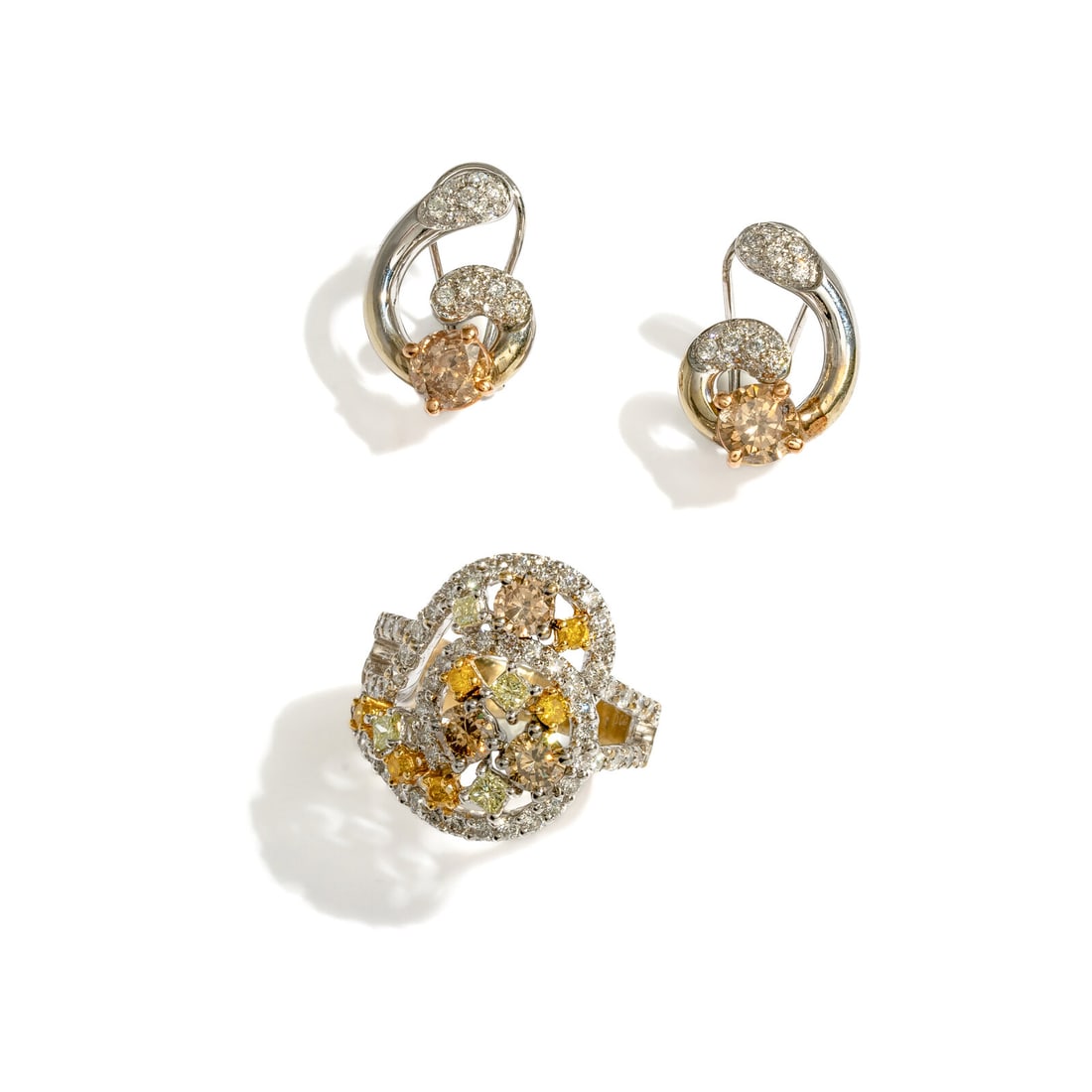 COLORED DIAMOND, DIAMOND, AND BICOLOR GOLD RING AND EARRINGS: COLORED DIAMOND, DIAMOND, AND BICOLOR GOLD RING AND EARRINGS Including a ring set with round and princess cut yellow and brown diamonds (origin of color not tested) weighing approximately 0.90 carat t