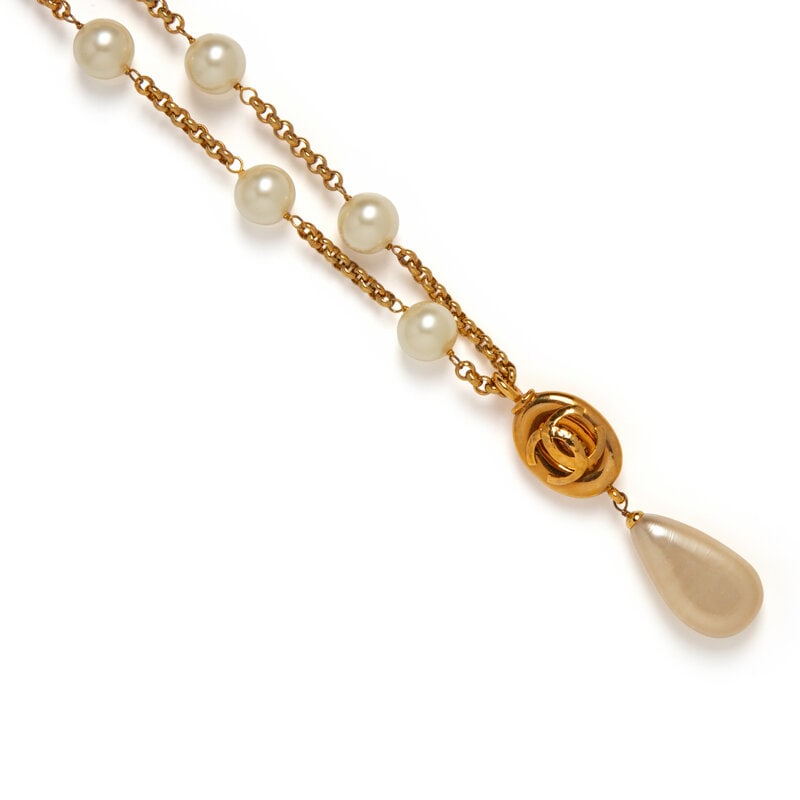 Chanel, Gripoix Pearl Station Necklace: Chanel, Gripoix Pearl Station Necklace Station necklace in gold-tone metal with large Gripoix pearl beads, with a hanging CC charm & teardrop Gripoix pearl pendant. Hook closure. Stamped with