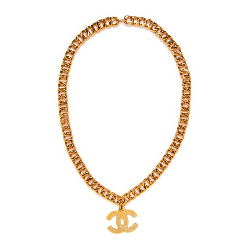 Chanel, Oversized CC Pendant Chain Necklace: Chanel, Oversized CC Pendant Chain Necklace Oversized Cuban chain necklace in gold-tone metal with a large CC logo pendant. Hook closure. Stamped with maker's marks at back of chain link. Label: