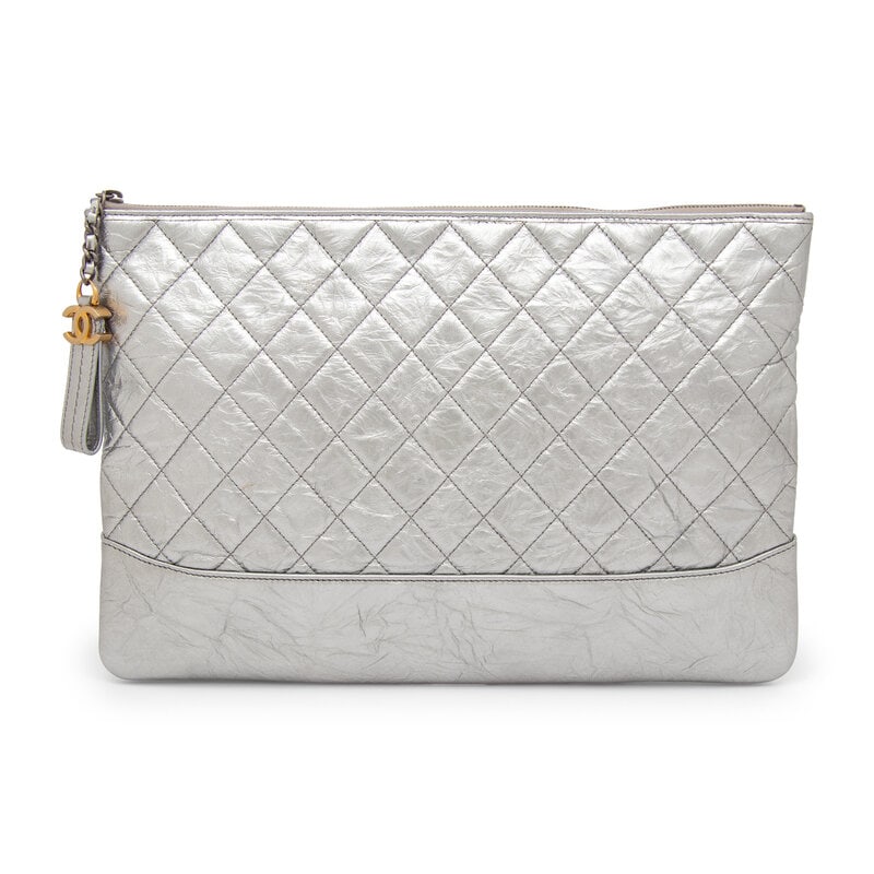 Chanel, Silver Gabrielle Flat Clutch: Chanel, Silver Gabrielle Flat Clutch Gabrielle O-Case flat clutch in quilted metallic silver aged calfskin. Zipper closure with CC & leather zipper pull. Label: Chanel Style/Serial No.: