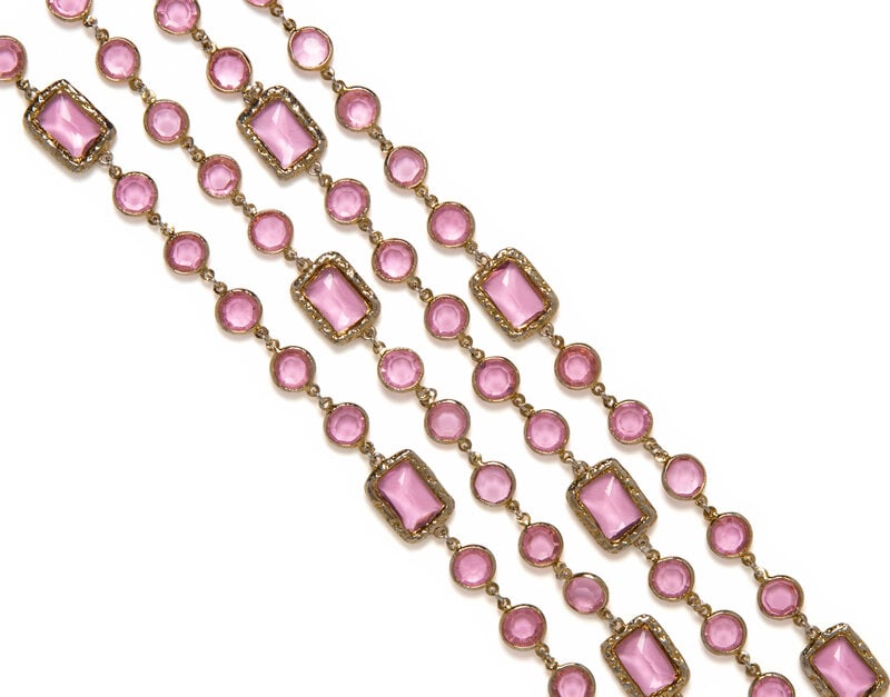 Chanel, Pink Glass Sautoir, 1981 : Chanel, Pink Glass Sautoir, 1981 Long sautoir in gold-tone metal and pink cut glass. No closures. Stamped with maker's mark at hanging tag. Label: Chanel Date: 1981 Country of Origin: France 