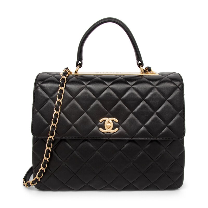 Chanel, Large Square Top Handle Flap Bag: Chanel, Large Square Top Handle Flap Bag Large Square Top Handle Flap bag in quilted black lambskin leather with gold-tone hardware. CC turn-lock closure, rolled leather handle, and interwoven