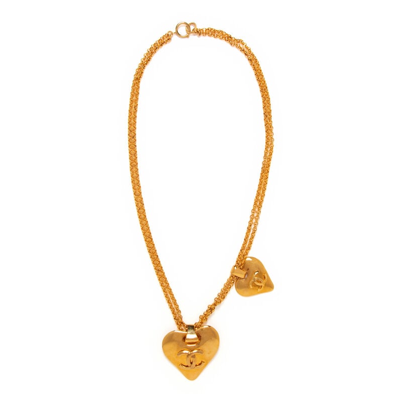 Chanel, Double Heart Pendant Necklace: Chanel, Double Heart Pendant Necklace Double-layered chain necklace in gold-tone metal with two differently sized CC heart pendants. Spring-loaded clasp closure. Stamped with maker's marks at back