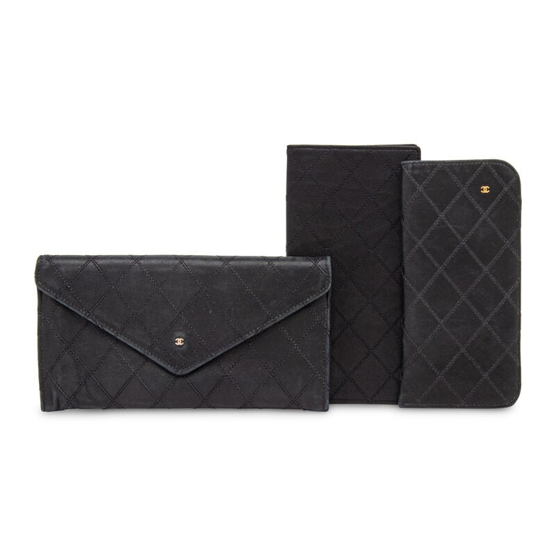 Chanel, Three Black Leather Articles: Chanel, Three Black Leather Articles THE FIRSTWallet in black lambskin leather with diamond topstitching and snap closure to flap.Label: ChanelStyle/Serial No.: 1398
